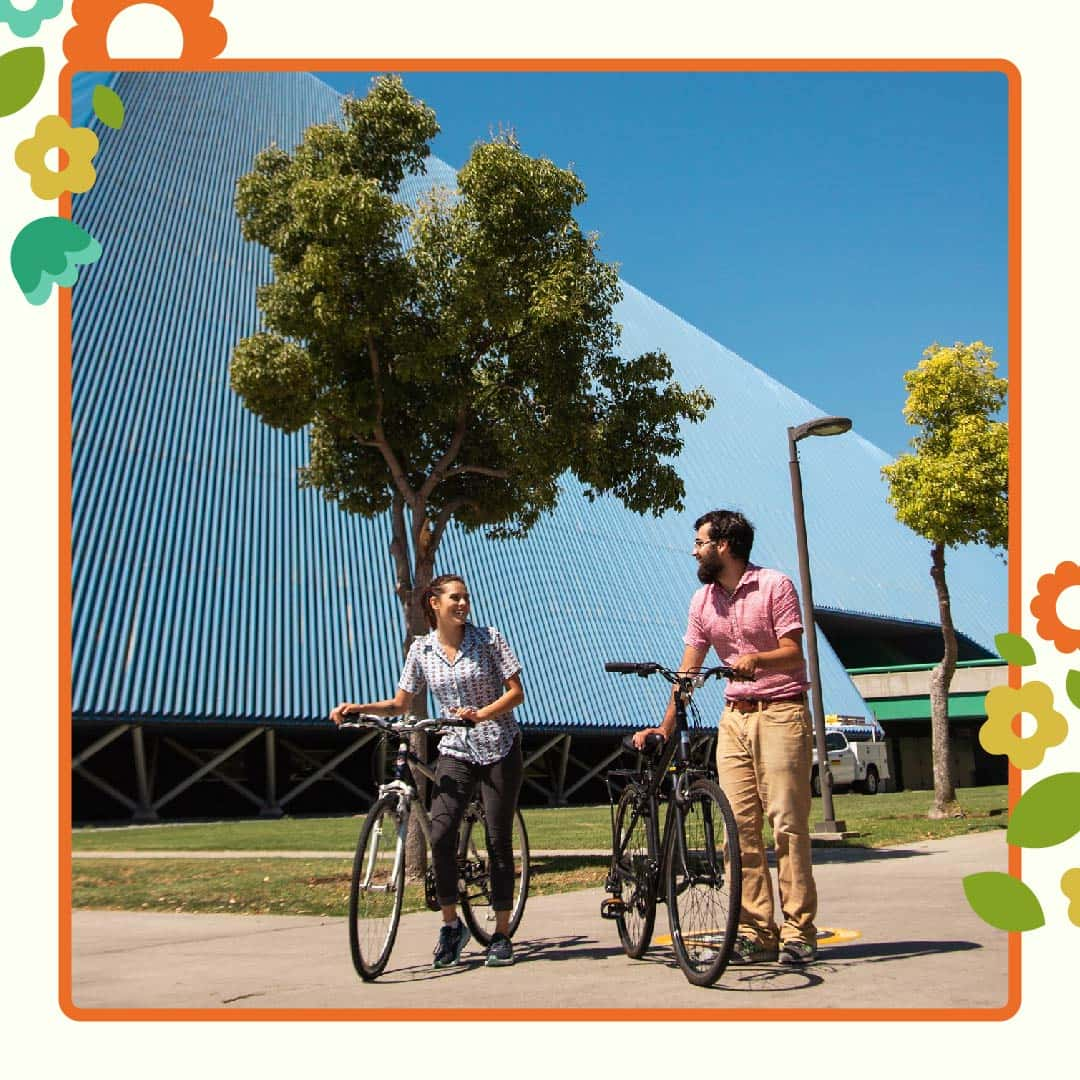 2 students with bicyles